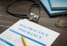 Medical malpractice insurance application with stethoscope.